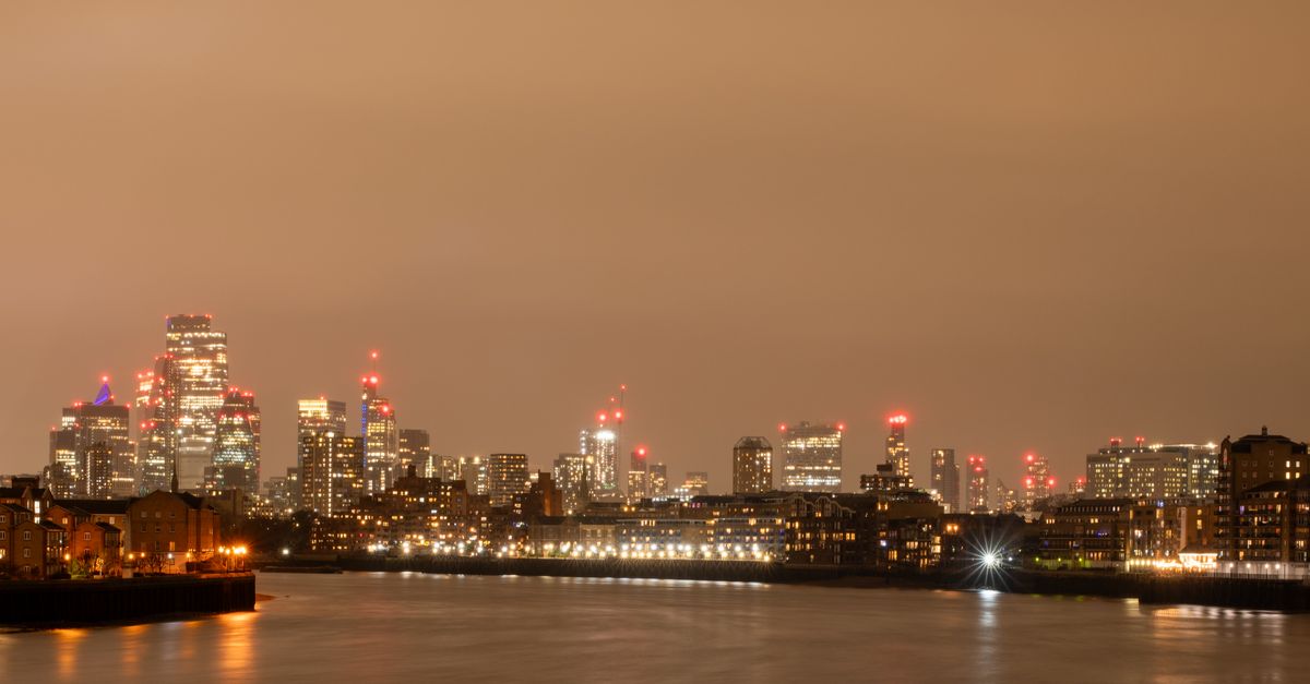 Things to Do in London in July 2026: Weather, Events & Travel Tips Stunning night view of London's skyline with the River Thames in the foreground, showcasing the city's illuminated towers.