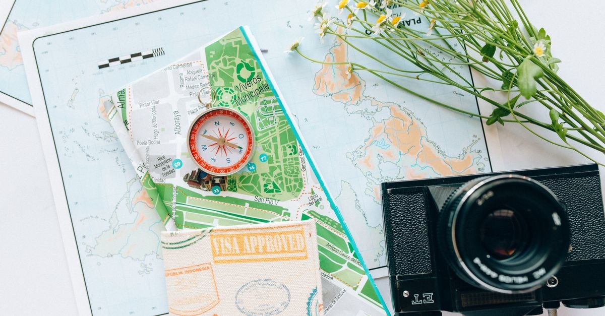 Explore your wanderlust with maps, a compass, and a vintage camera.