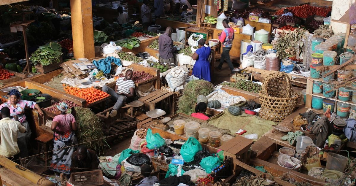 Explore the bustling activity and vibrant colors of Jinja Central Market in Uganda.