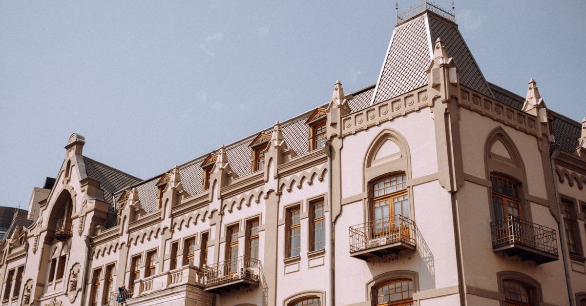 Things to Do in Tbilisi: A September City Guide A classic building showcasing Tbilisi's unique architectural style under a clear sky.