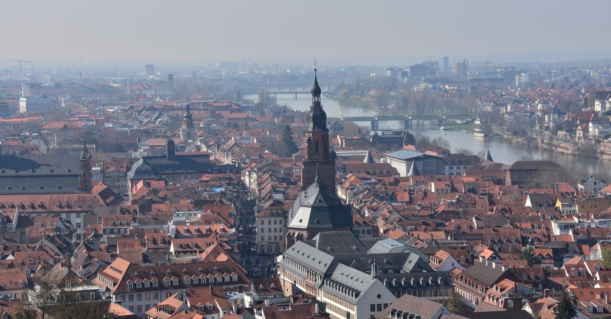 Novotel Karlsruhe City in Karlsruhe: Steps from the Hauptbahnhof and the Schloss Aerial view of Heidelberg showcasing historic church and Neckar river on a clear day.