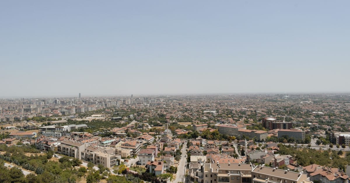 Konya Öğretmenevi in Konya: A Historic Teacher's House Near the City's Cultural Landmarks Stunning aerial view of Konya, Türkiye showcasing its urban landscape under a clear sky.