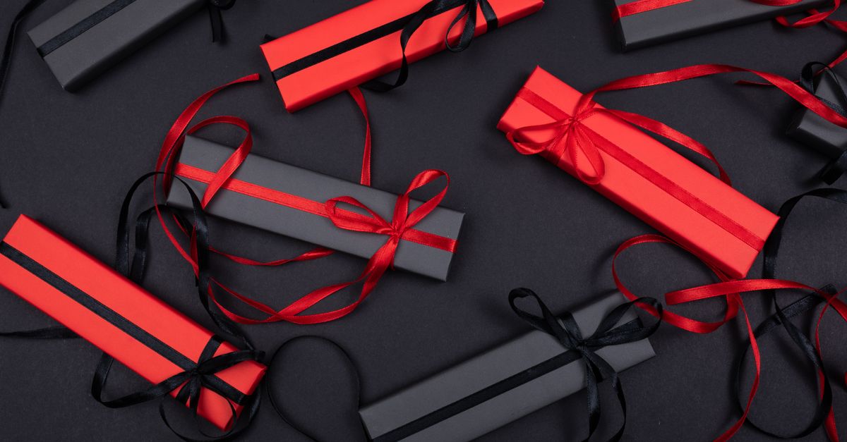 Steam Update Brings Email Gifting and Wishlist Categories as Black Flag Resynced Holds Top 10 Stylish flatlay of red and black gift boxes on a black surface with decorative ribbons.