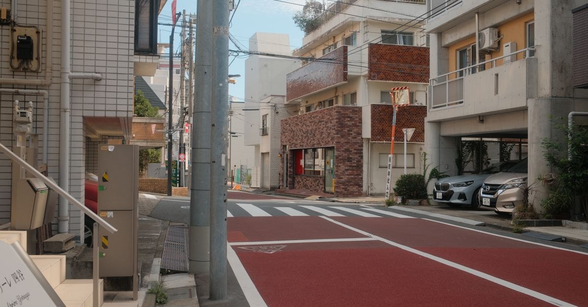 A peaceful street scene in Shinjuku City, Tokyo, Japan with modern architecture.