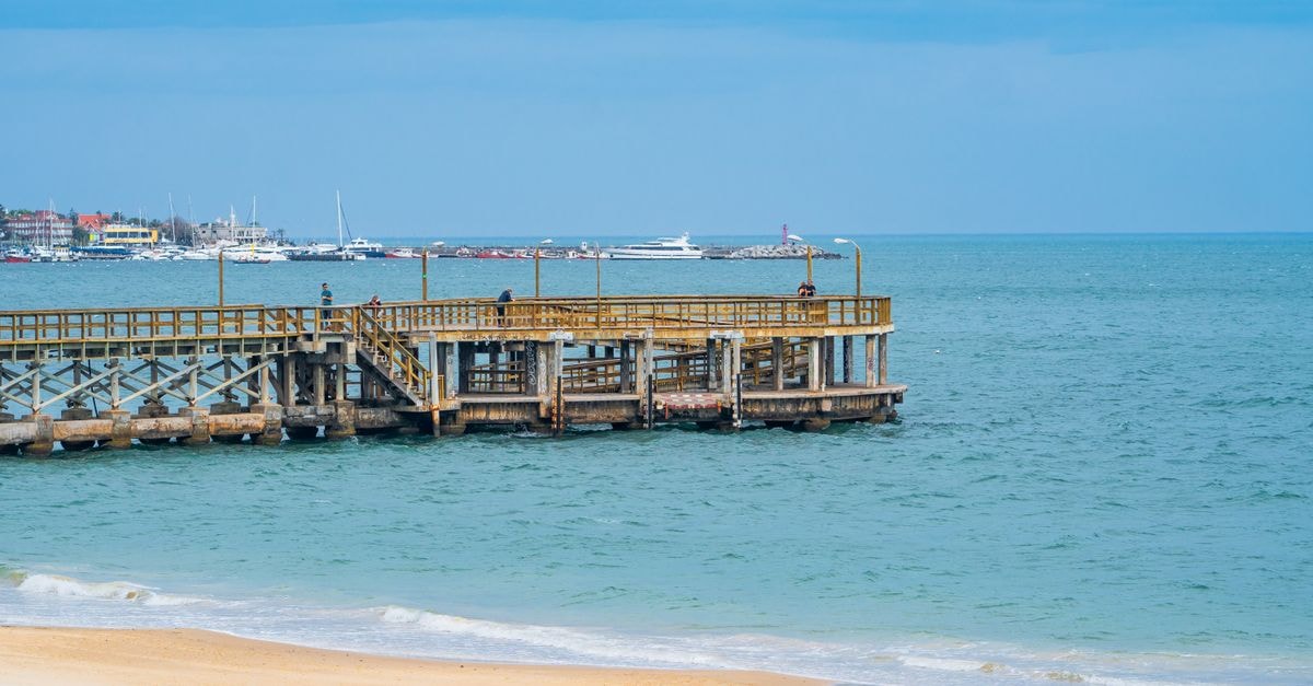 Richards Bay Travel Guide: Planning Tips, Costs and Things to Do Tranquil view of a wooden pier and beach in Punta del Este, Uruguay on a sunny day.