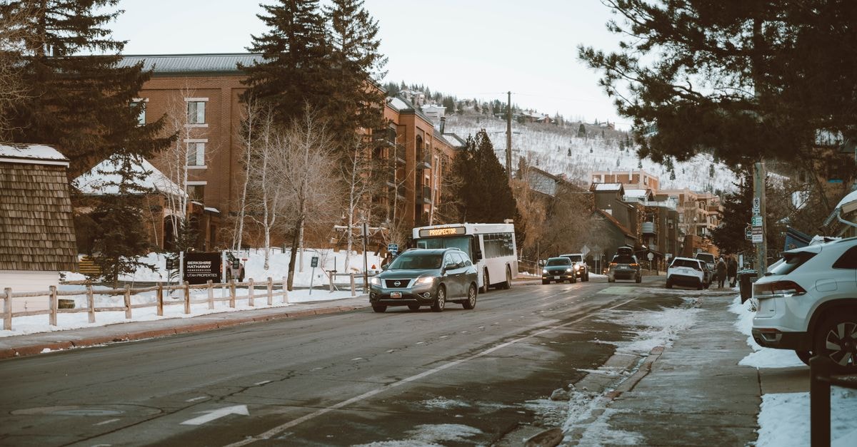 A thoughtful Durango travel guide for slow, curious visitors Snowy street view in Park City, Utah with parked cars and pedestrians