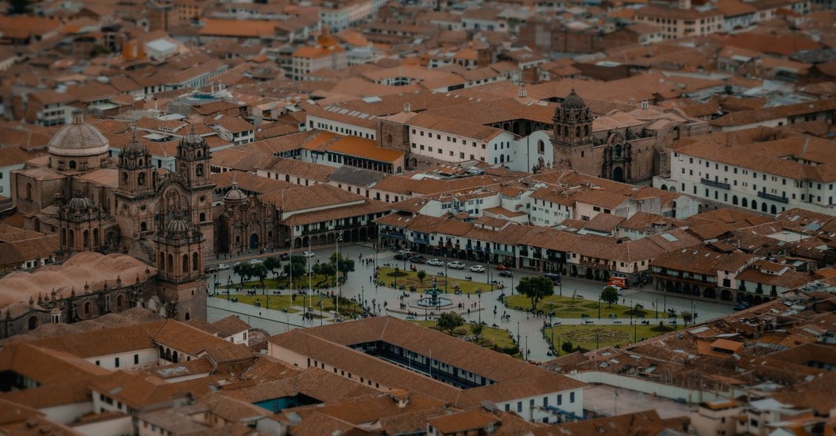 Hotel Aristo Gold in Tunja: Modern Rooms Near Unicentro Drone view capturing the Plaza de Armas, Cusco, with its historic architecture and vibrant cityscape.