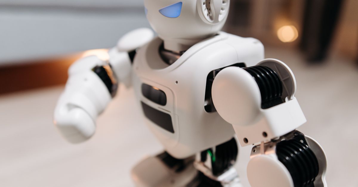 KAIST and Nvidia Launch Physical AI Center as Musk Predicts Robotics-Led Abundance Close-up of a futuristic toy robot with blue eyes, showcasing modern technology indoors.