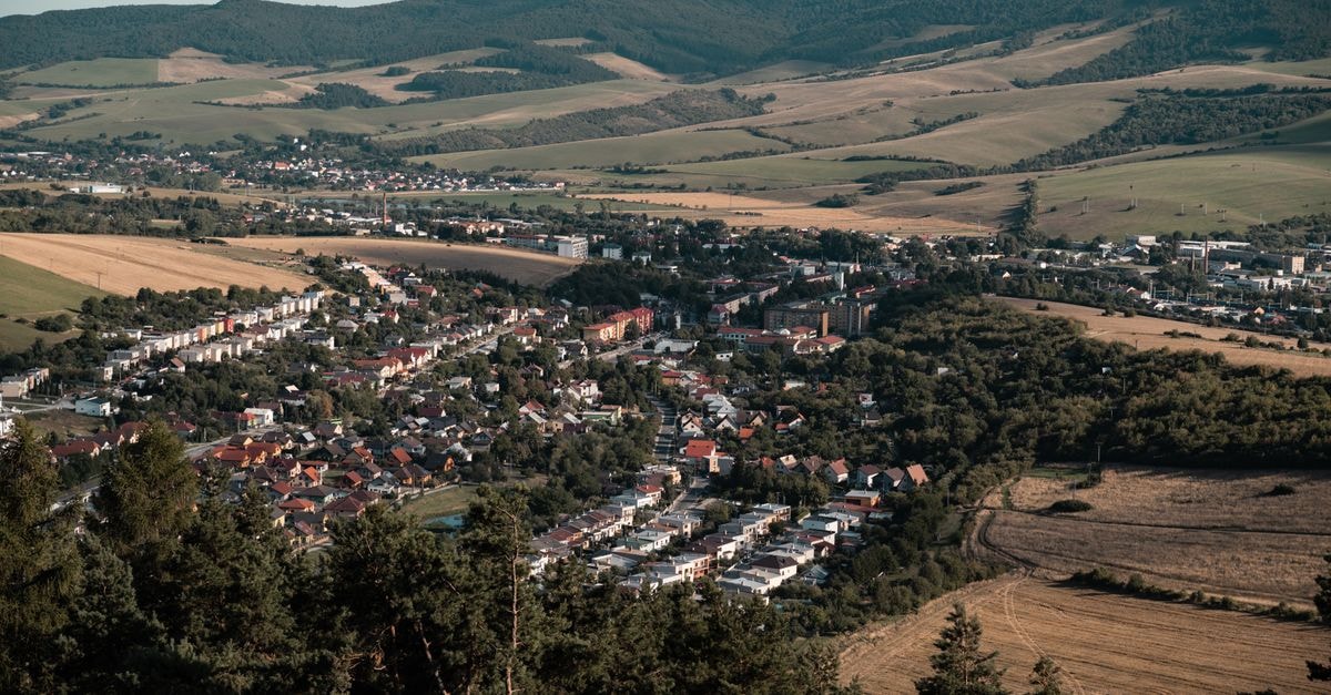 A scenic aerial view over Lipany, Slovakia, showcasing vast landscapes and charming town architecture.