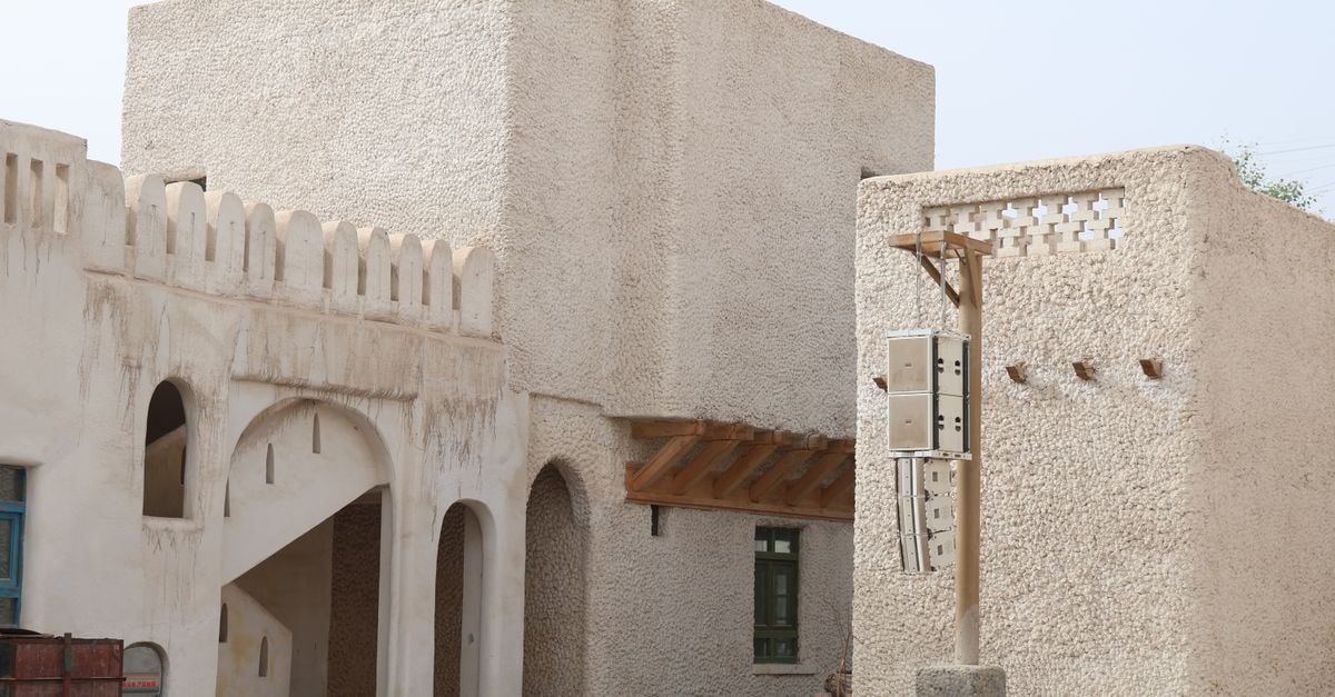 Outdoor view of a traditional adobe building showcasing Middle Eastern architectural style.