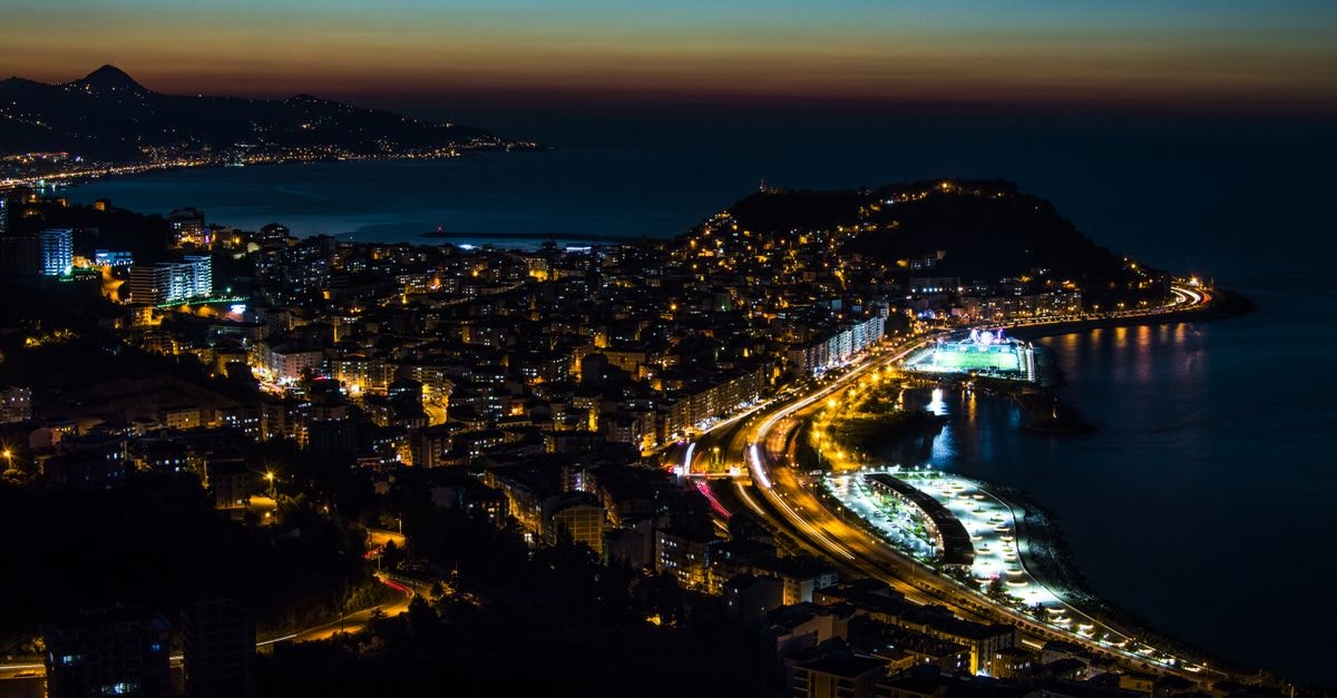 Twilight over Giresun, Türkiye with illuminated cityscape and beautiful coastline.