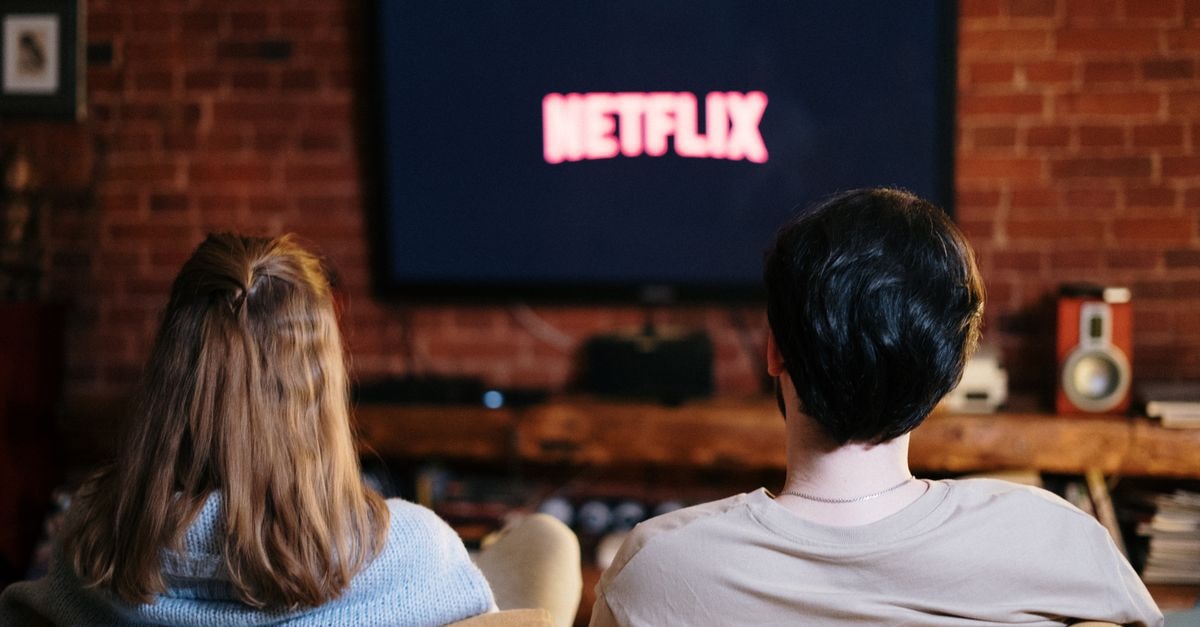 Skip and Loafer Season 2 Sets April 2027 Premiere With Teaser Trailer A couple enjoys a relaxed evening watching Netflix in their living room.