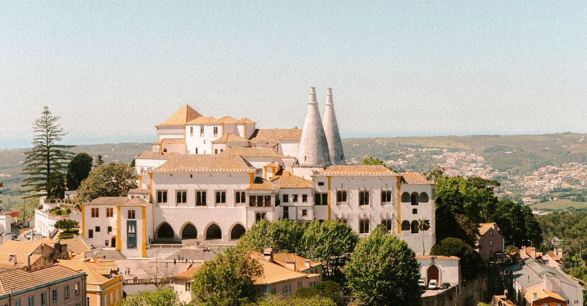 Beautiful view of Sintra National Palace, Lisbon, highlighting its unique architecture and scenic surroundings.