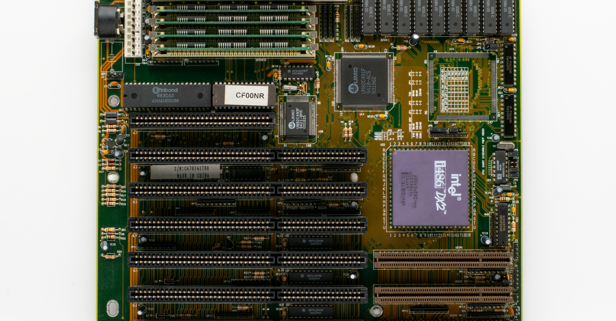 Intel Proposes $15 Billion Common Stock Offering to Fund Capital Spending and AI Expansion High-resolution image of a vintage computer motherboard showcasing Intel chip and circuitry.