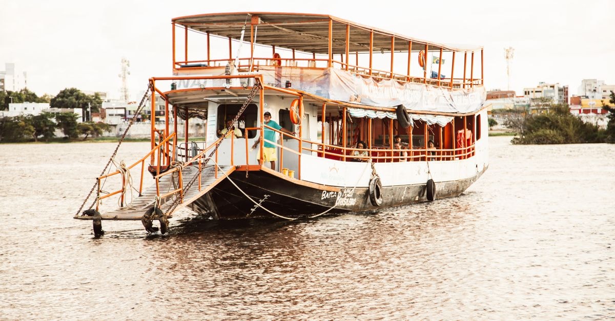A picturesque boat ride on a serene Brazilian river, perfect for a relaxing adventure.