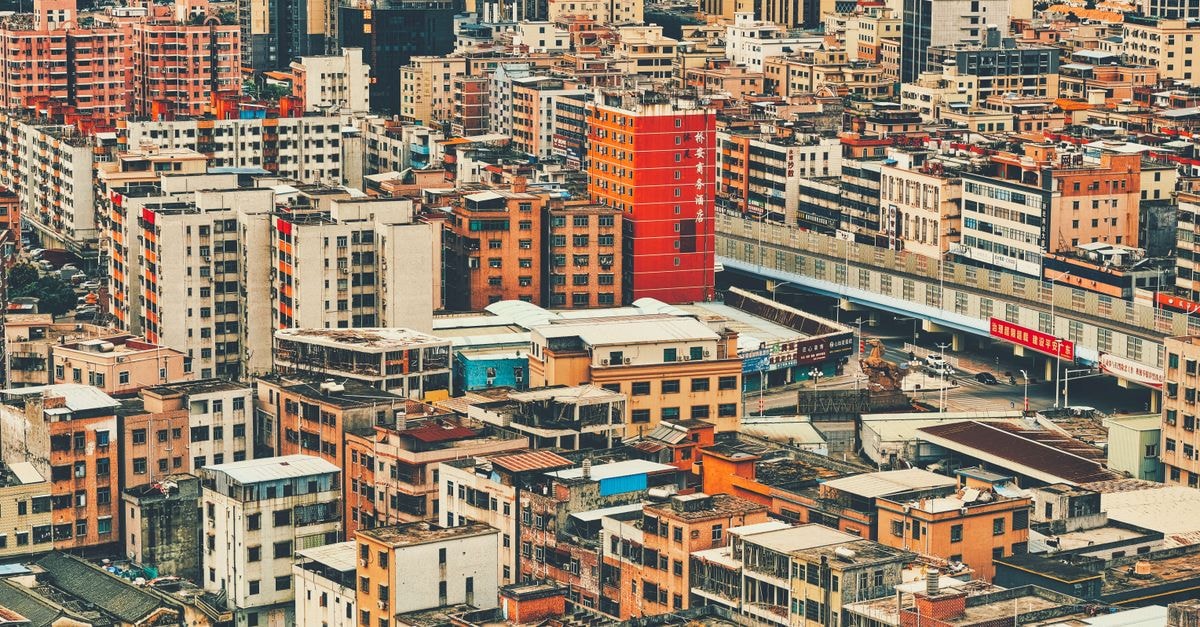 Wanda Vista Dongguan, Dongguan: City-Center Address in Dongcheng Aerial view of the densely packed buildings in Dongguan, China showcasing the urban density and architecture.
