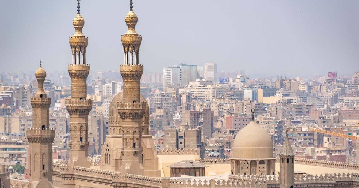 New Cairo Travel Guide: Planning Tips, Costs and Things to Do Scenic aerial shot of intricate Islamic architecture with cityscape in Cairo, Egypt.