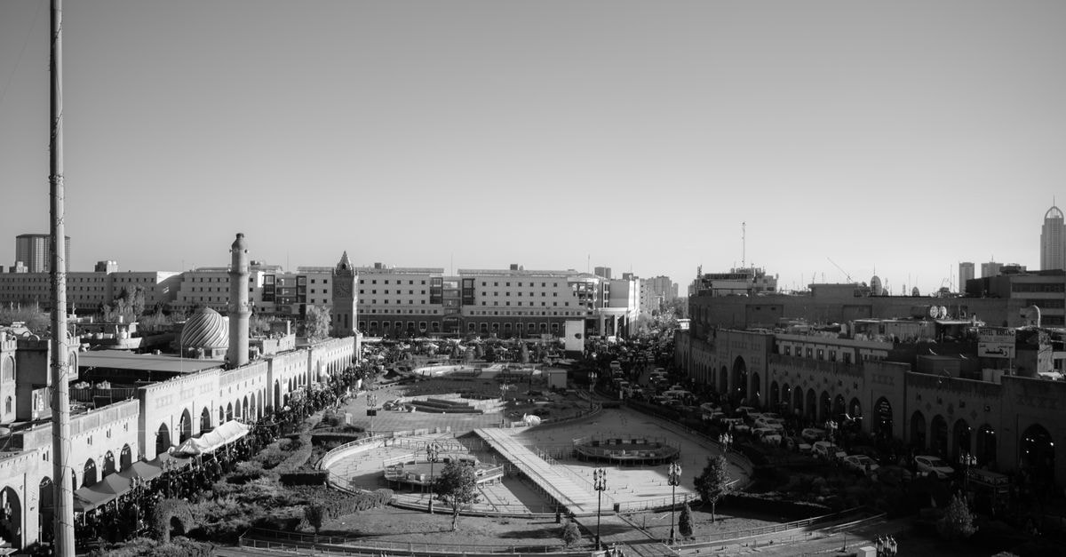 Miremad Hotel in Qazvin: A Boulevard Address Since 2010 A striking black and white aerial view showcasing Erbil's town square, depicting urban life and architecture in Kurdistan, Iraq.