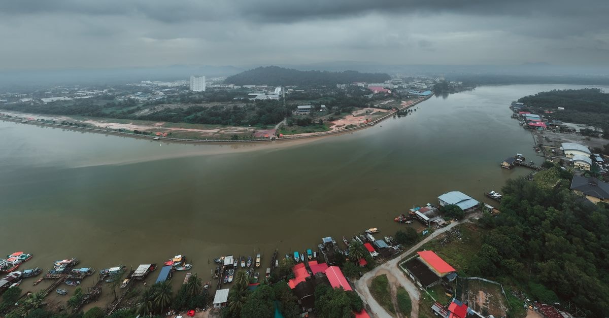 King Park Hotel in Tawau: Panoramic Views and a Central Town Hub Aerial photograph of the Chukai River and surrounding landscape in Terengganu, Malaysia under cloudy skies.