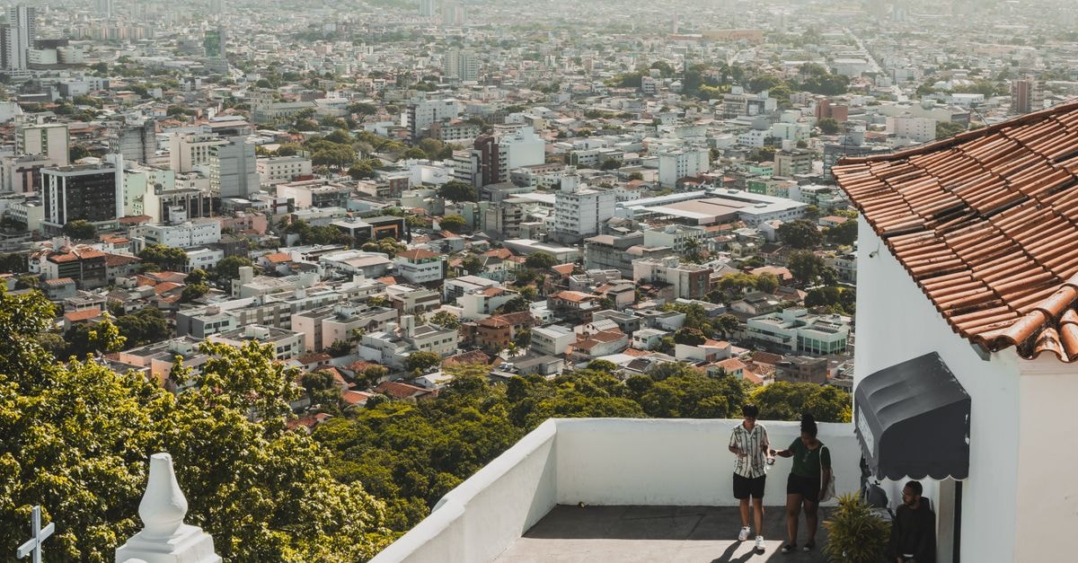 Bauru travel guide: a warm inland city worth slowing down for Overlooking cityscape from an elevated white terrace with people enjoying the view.