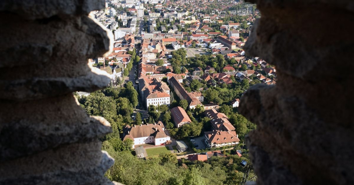 PanGeea Hostel in Sibiu: Steps from the Old Town Explore the beautiful cityscape of Deva, Romania through ancient fortress ruins.
