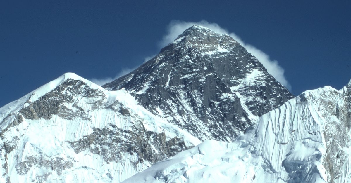 Everest Hotel in Poltava: 30 Rooms with a Ground-Floor Café Majestic winter view of snow-covered Mount Everest under a clear blue sky, captured from Khumjung, Nepal.