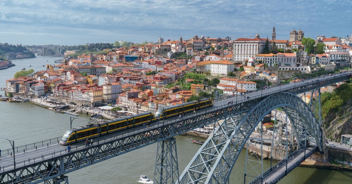 Hôtel Maharajah, Mamoudzou — Indian-Inspired Calm in Mayotte's Capital Stunning aerial shot of the iconic Luís I Bridge spanning the Douro River in Porto, Portugal.