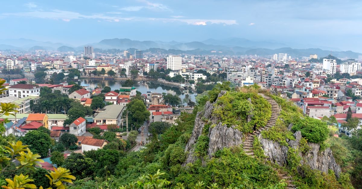 Breathtaking aerial view of Lang Son City with Mac Citadel's rock formations and vibrant urban landscape.
