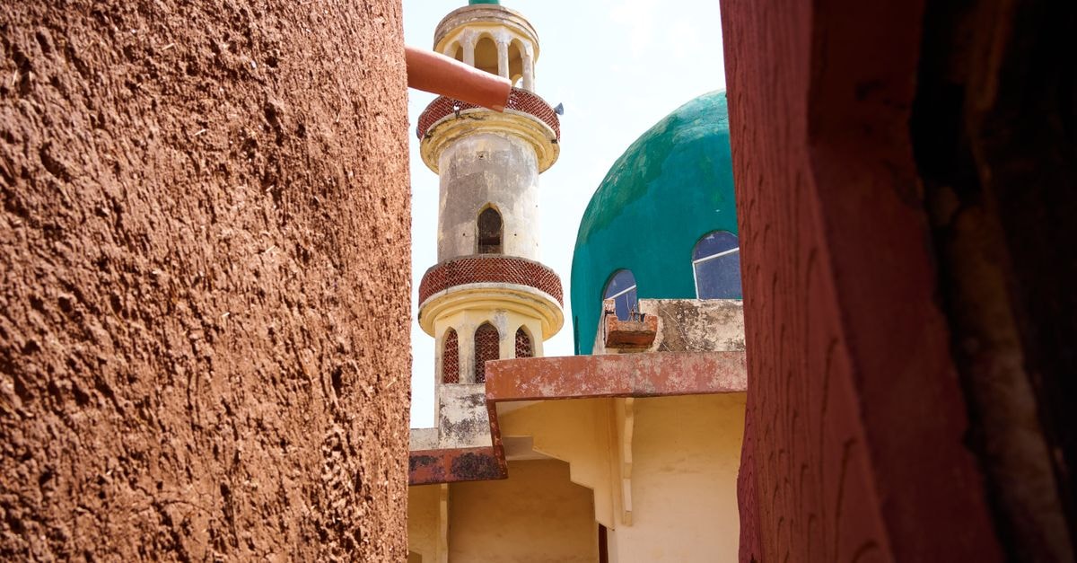 Colorful architectural details of a mosque in Kano, Nigeria, showcasing its vibrant design.