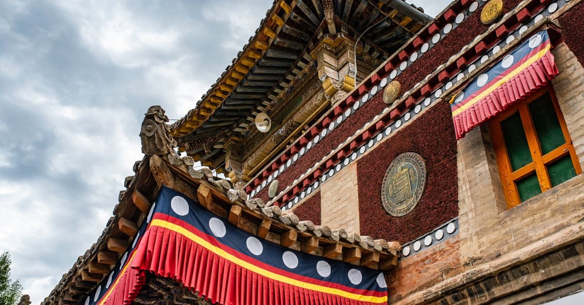 Baiyin Travel Guide: A Quiet Corner of Gansu Worth a Stop Low angle view of an ornate traditional Chinese pagoda showcasing intricate architectural details and vibrant colors.