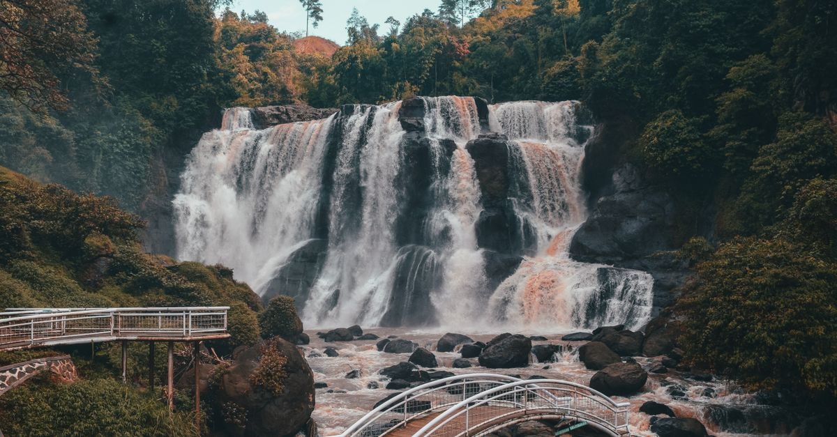 Man, Ivory Coast Travel Guide: Waterfalls, Green Roads, and West African Flavor Discover the awe-inspiring Curug Malela waterfall in lush West Java with scenic viewing decks.