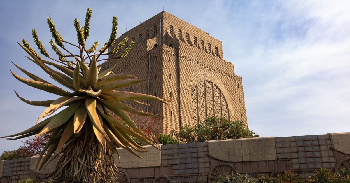The iconic Voortrekker Monument set against a blue sky in Pretoria, South Africa.