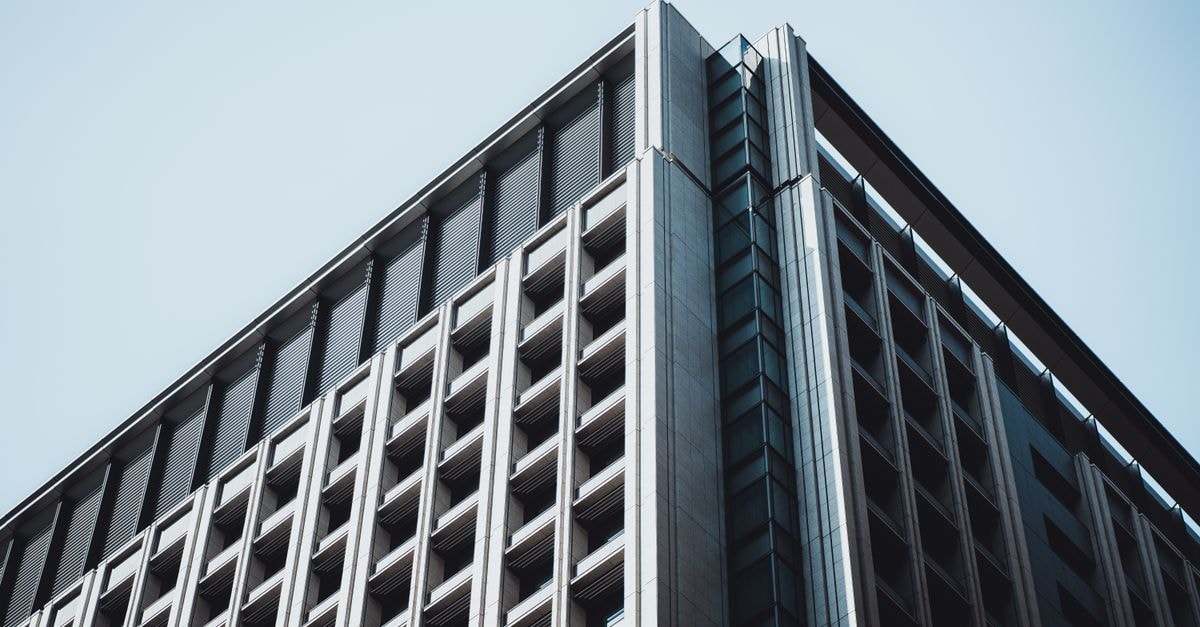 Multiple small institutional investors open new U.S. Bancorp stakes in Q2 13F filings Contemporary office building with geometric patterns in Tokyo, Japan.