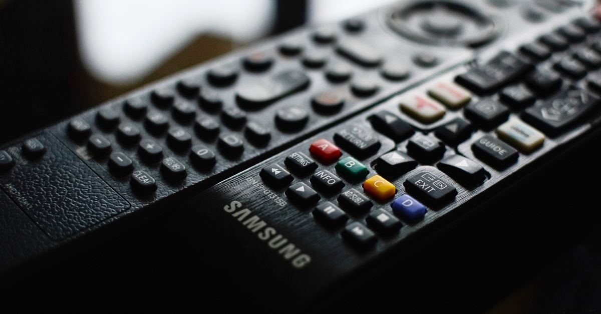 Korea Investment Lifts Samsung Electronics Target as Samsung Life Waives IRP Fees Detailed close-up of a Samsung remote control showcasing buttons and logo.