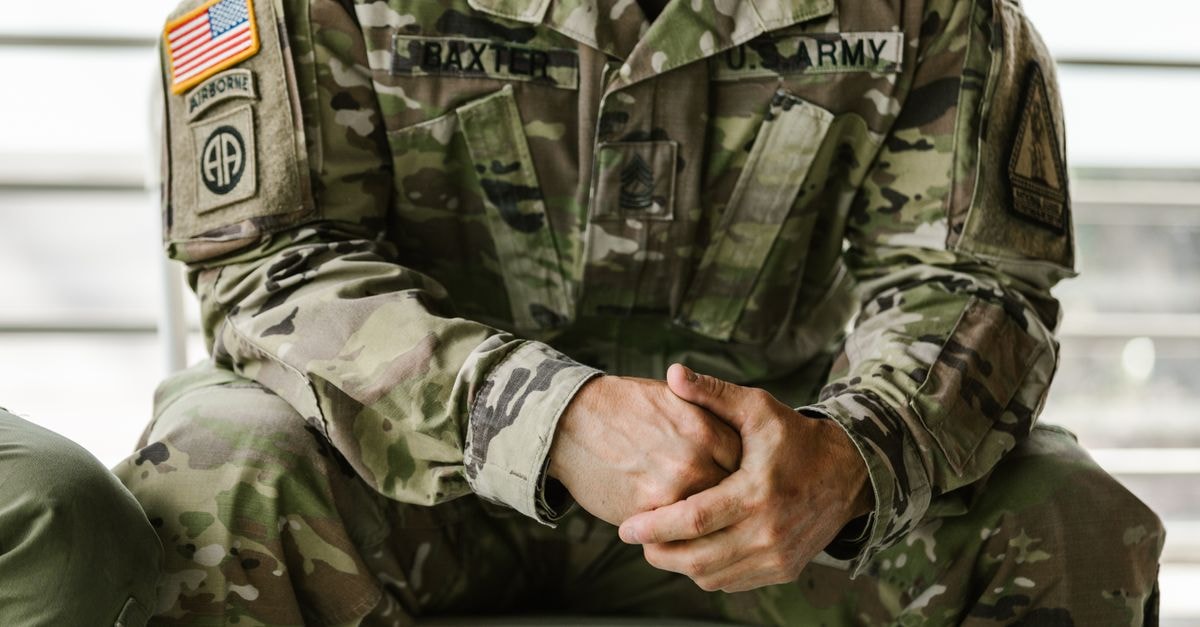 U.S. Navy awards Raytheon $22.9 billion contract to accelerate Tomahawk missile production Close-up image of a soldier wearing a camouflage military uniform, displaying patches and insignia.