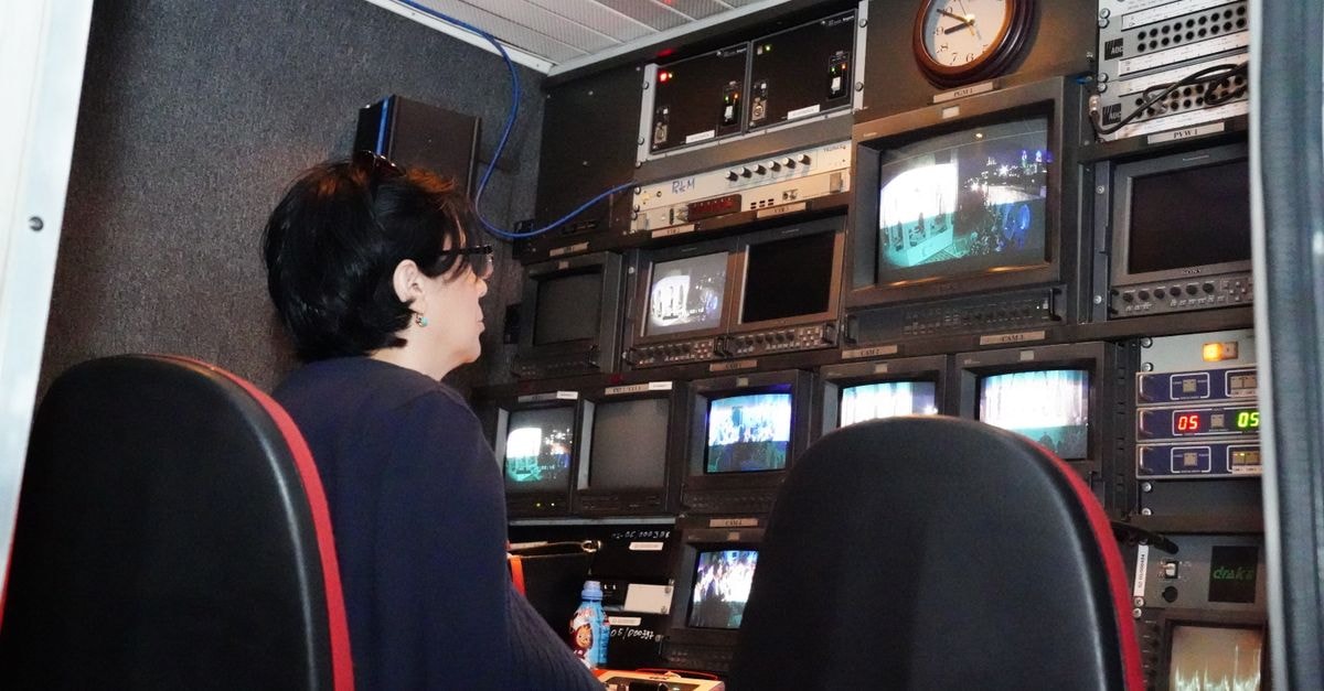 Jeff Goldblum to host season two premiere of Saturday Night Live UK A professional in a TV broadcast control room with multiple screens and equipment.