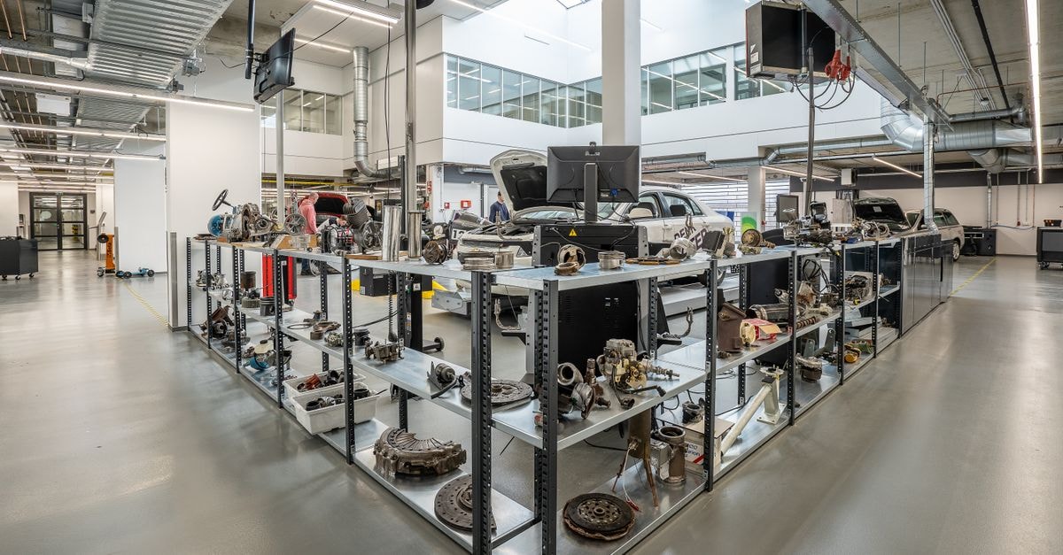 Gentex Corporation: A Disciplined Auto-Electronics Compounder at a Discount Spacious auto workshop showcasing various car parts and repair equipment.