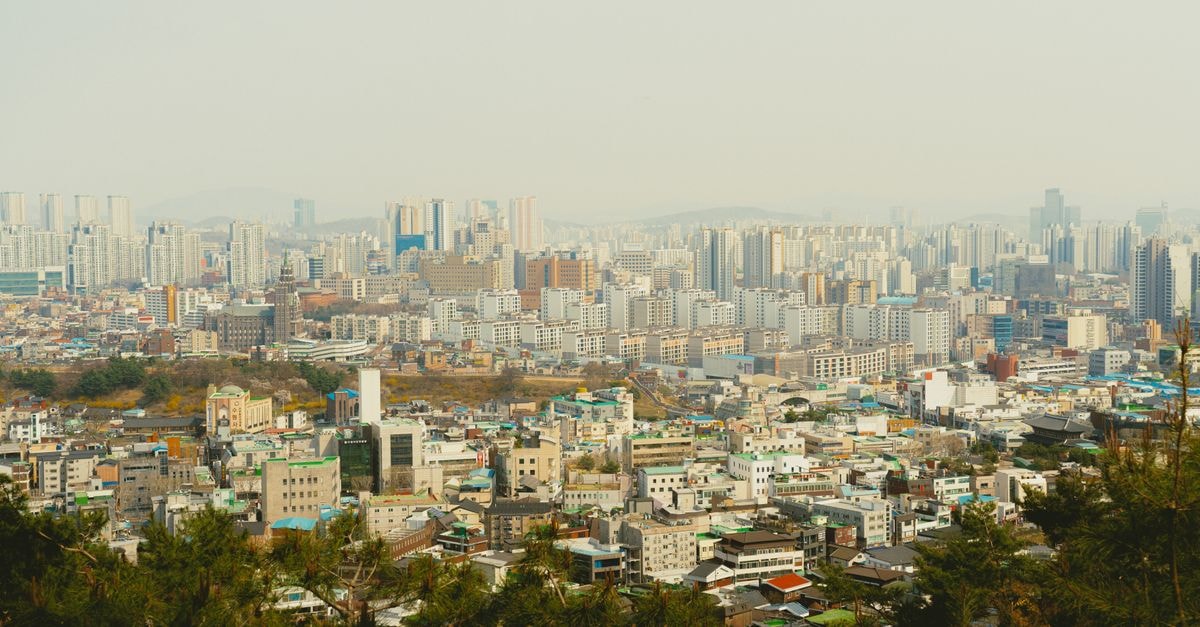 Aerial view of Seoul, South Korea showcasing urban cityscape and high-rise buildings on a clear day.