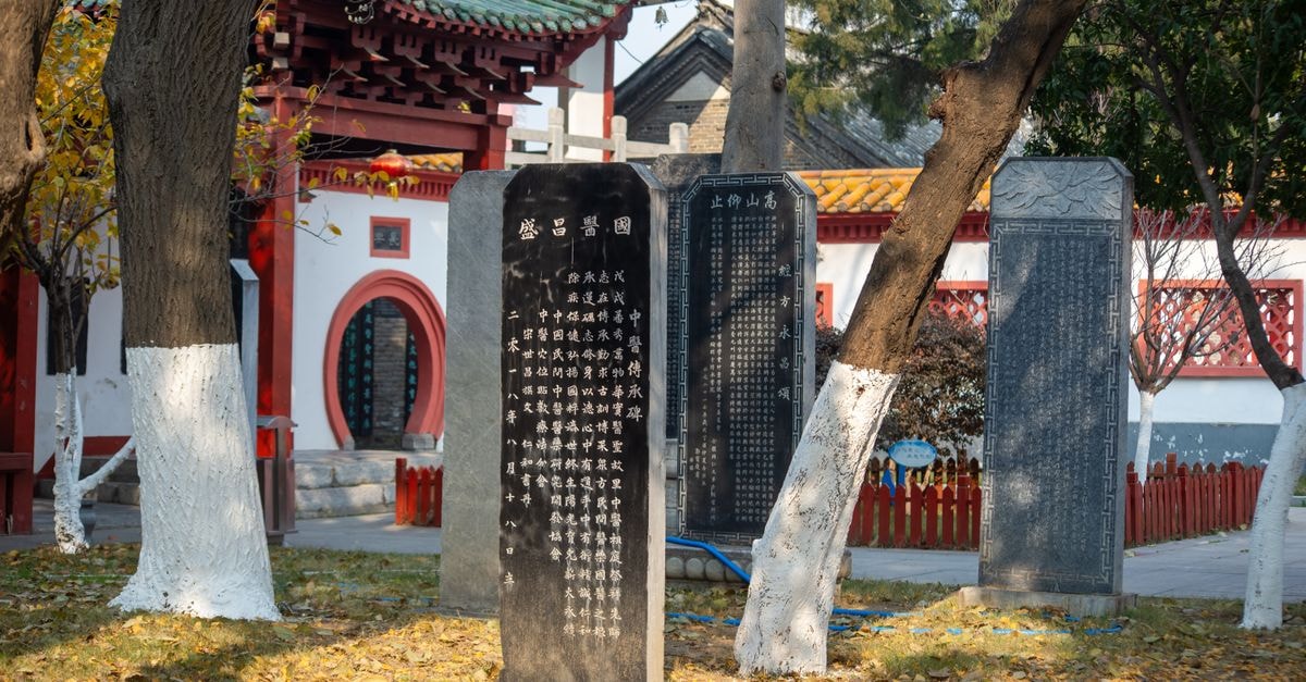Yangquan Travel Guide: A Quiet Shanxi Escape Beyond the Headlines View of an ancient Chinese temple surrounded by historic stone tablets and autumn foliage, creating a serene atmosphere.