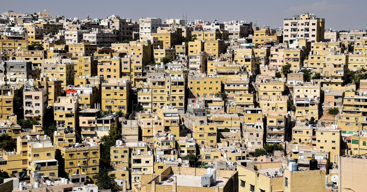 Diar Abou Habibi in Tozeur: Tree-Top Lodges in a Working Palm Grove Aerial view of the densely packed residential buildings in Amman, Jordan with clear skies.