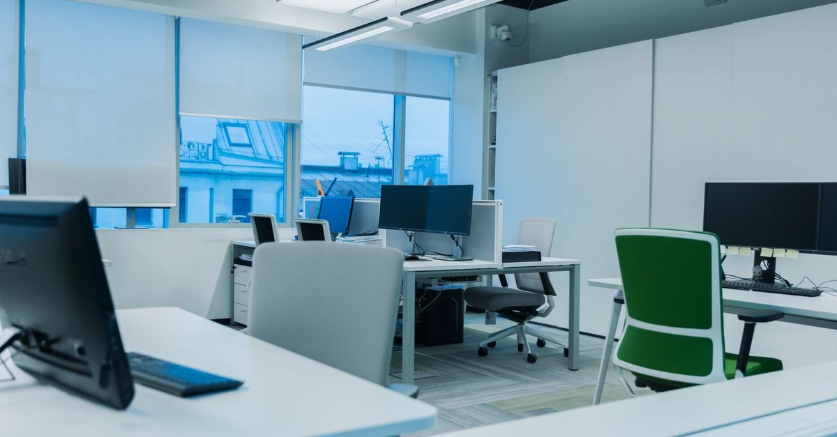 Casella Waste Systems: Growth-Through-Acquisition Priced for High Expectations Bright and modern office environment with computer workstations and large windows.