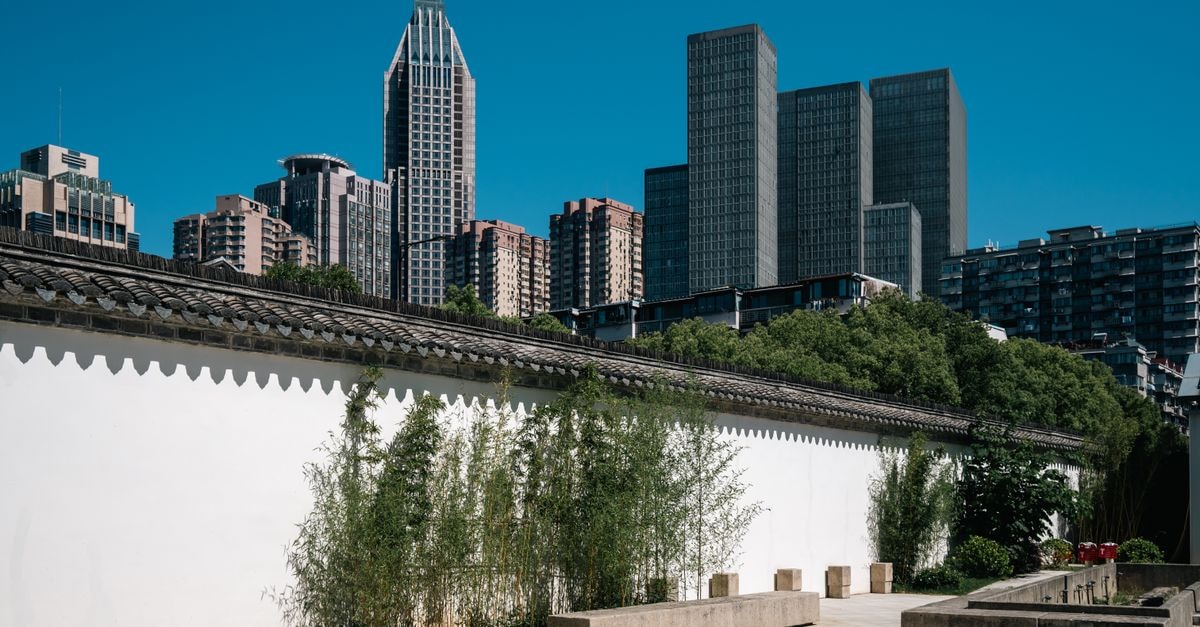 Contrast of modern skyscrapers and traditional Chinese architecture in Nanjing, Jiangsu province.