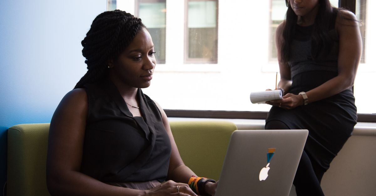 Rosenblatt Initiates Uber Coverage With $100 Target, Citing 'Durably Compounding Platform' Two women in a business setting working on a laptop and taking notes, fostering teamwork.