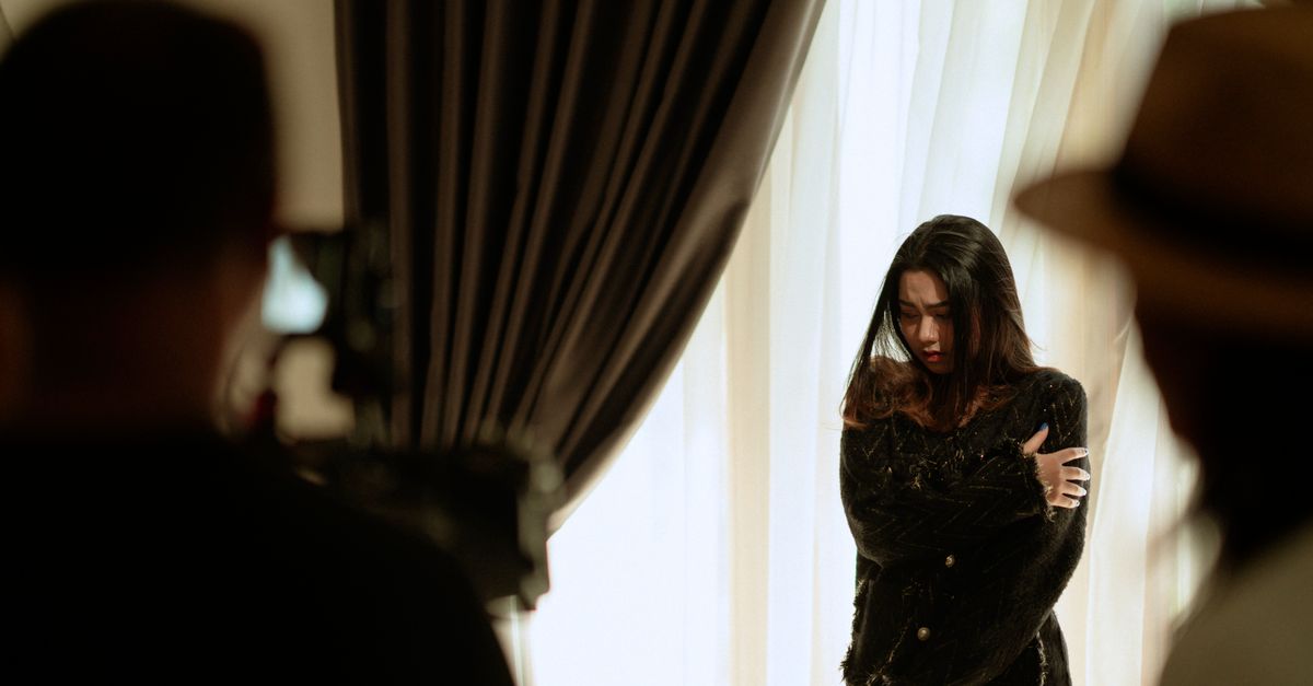 Ong Xuan Jing ties for Best Actress at MIFFest; Jecheon and Venice announce September plans A woman actor performing a scene indoors, captured with dramatic lighting and intense emotion.