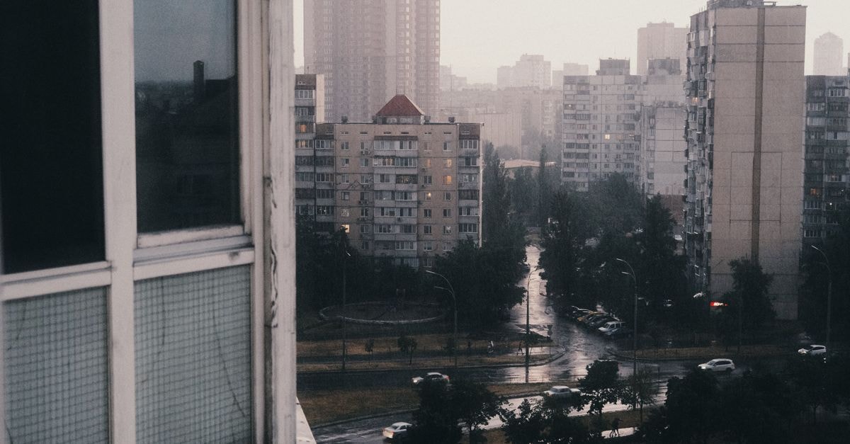 Pamela in Negotino: A Vardar Hub for the Tikveš Wine Circuit Moody cityscape showcasing high-rise buildings in a rainy urban setting.