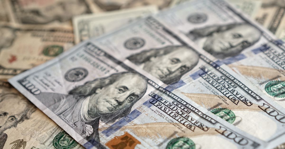 Detailed view of US dollar banknotes showcasing currency and investment themes.
