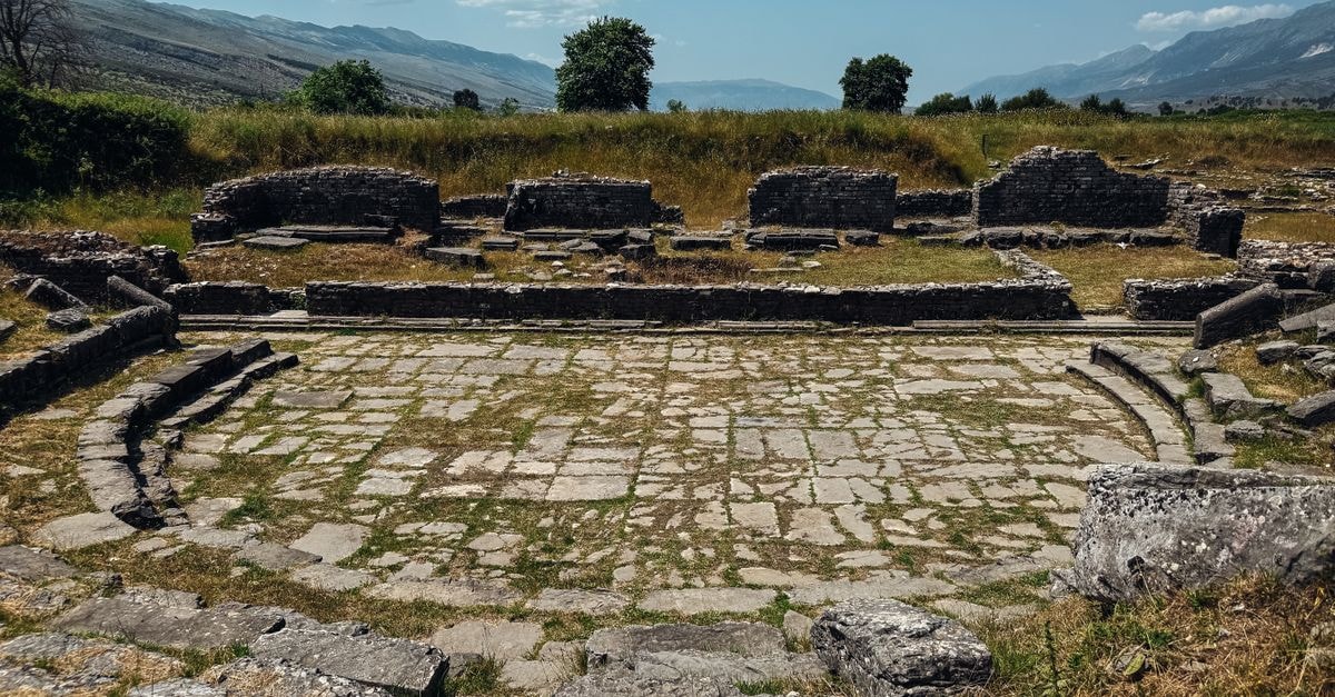 Medea Travel Guide: Planning Tips, Costs and Things to Do Explore the ancient amphitheater ruins amidst beautiful landscapes in Albania.