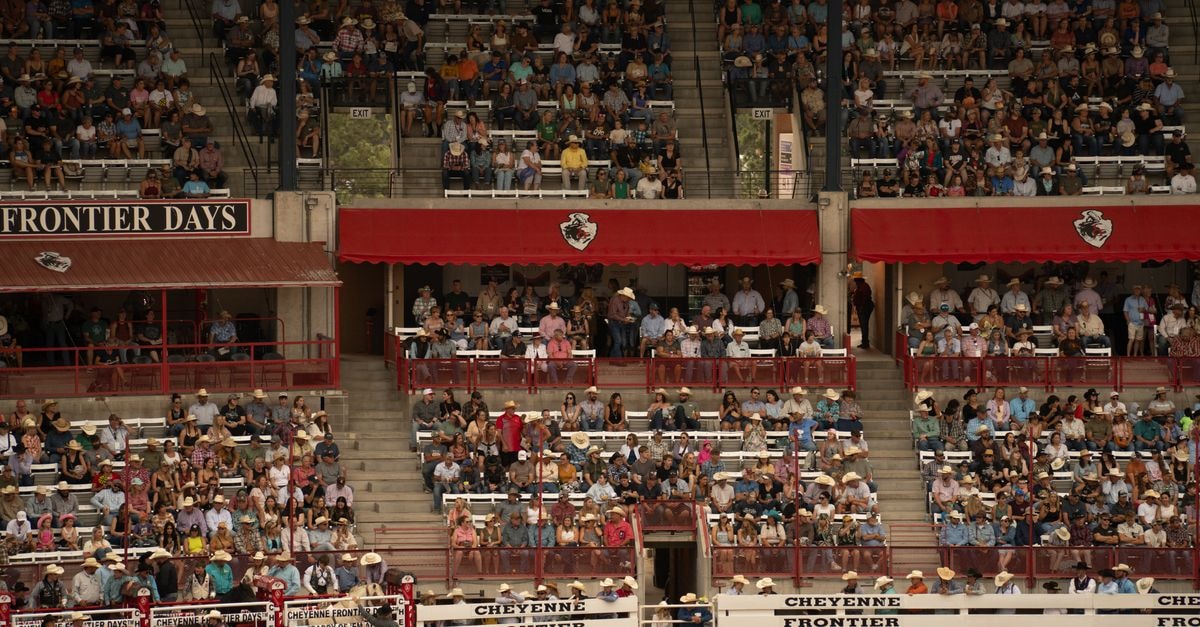 The Historic Plains Hotel in Cheyenne: A 1911 Frontier-Era Landmark A large crowd enjoys the lively atmosphere at Cheyenne Frontier Days Rodeo in Wyoming.