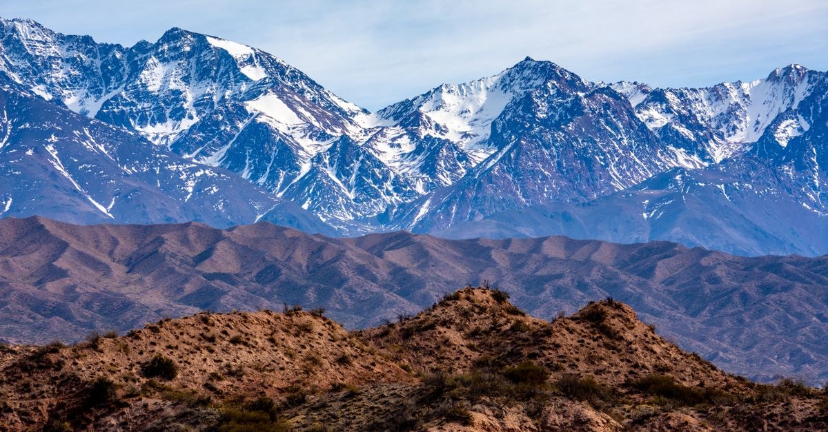 Park Hyatt Mendoza: Plaza-Side Classic in the Heart of Mendoza Stunning view of the Andes Mountains with snow-covered peaks and rugged terrain.
