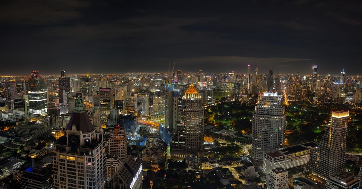 The Printing House Poshtel Bangkok in Bangkok: A 1940s Printing House Turned Poshtel A breathtaking aerial view of Bangkok's vibrant cityscape illuminated at night.